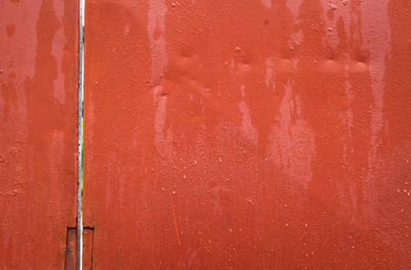 Wet Red Metal plate for texture and background.の写真素材