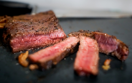 Pink Medium rare beef steak cut in to piecesの写真素材