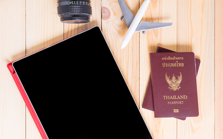 Travel stuff with blank computer tablet with copy space on the screen.の写真素材