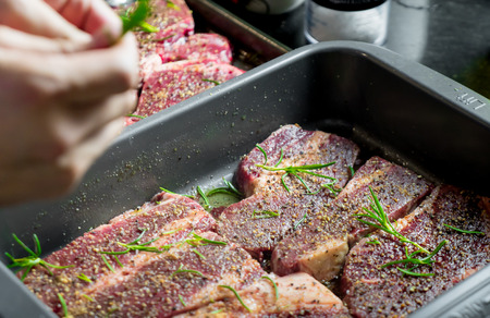 Raw Beef Steak with spices and seasoning preparation for grill.の写真素材