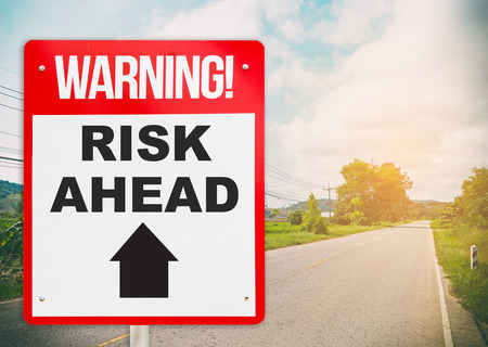 Warning sign on the road ahead say Risk Ahead. Business and risk management concept.の写真素材