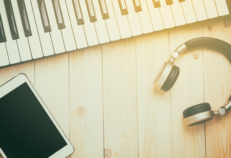 Hi tech Music instrument on wooden table with copy space.の写真素材