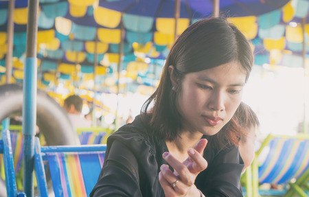Asian women is sitting on a beach chair in Pattaya Thailandの写真素材