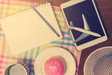 Planing travel vacation trip in a cafe with vintage colorの写真素材