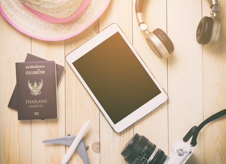 Hi tech traveler Gadgets traveling stuff with blank tablet screen.の写真素材