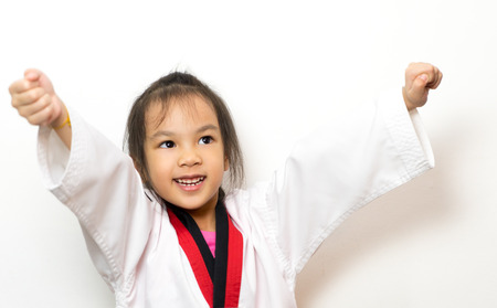 Asian girl is happy she winning Martial Art Competitionの写真素材