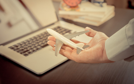 Office worker hand holding a plan business travel concepts.の写真素材
