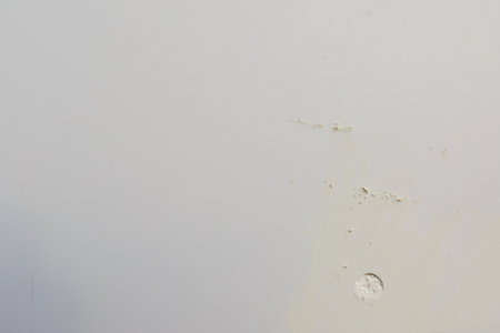 white Cement wall with cracked surface for background.の写真素材