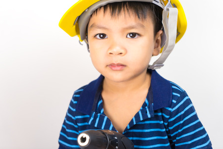 Asian boy is acting in Mechanic Engineer roles.の写真素材