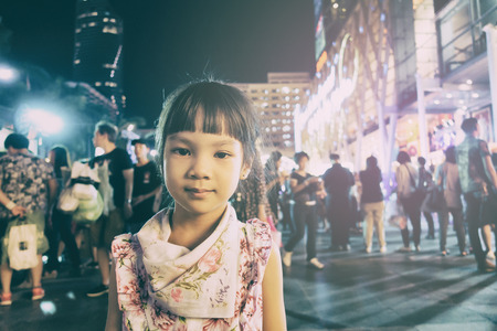Asian Girl Standing in Festival holiday street light.の写真素材