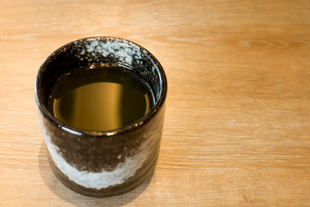 Japanese Green Tea Matcha in Black pottery art mugの写真素材