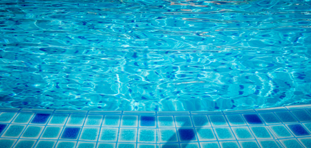 Swimming pool blue water ripple texture backgroundの写真素材
