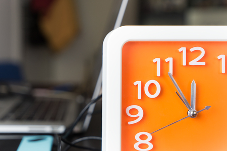 Orange clock is counting to Lunch breakの写真素材