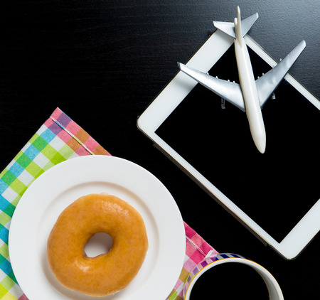 Vacation travel in cafe concept with donutの写真素材
