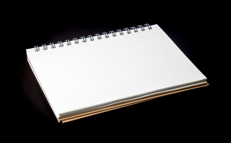 Blank notebook binder on black wooden deskの写真素材