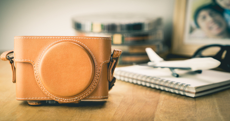 Travel blogger camera with picture page on deskのeditorial素材