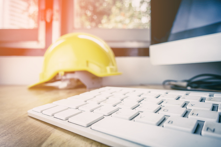 Engineer office working desk with desktop computerの写真素材