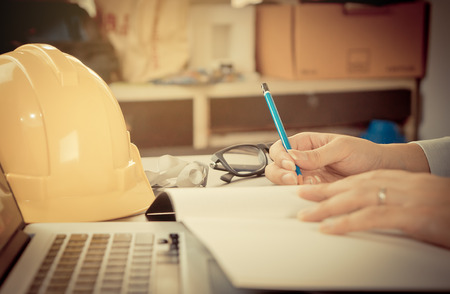 Construction engineer is working in his officeの写真素材