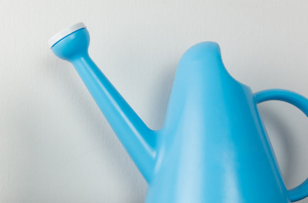 Blue plastic garden watering potの写真素材
