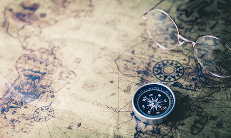Vintage world Explorer equipment with compass on vintage mapの写真素材