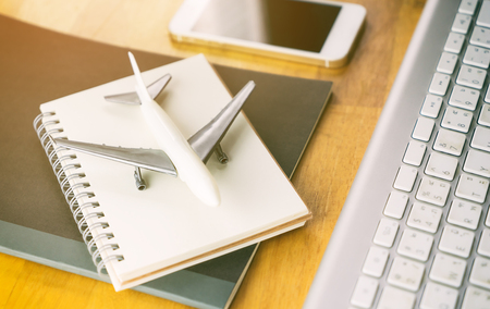 Office worker taking vacation travel concept on office deskの写真素材