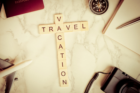 Travel Vacation text on marble with travel accessoriesの写真素材