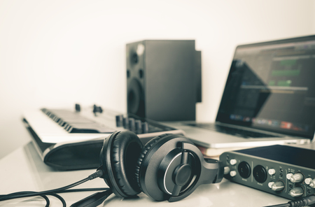 Music headphone lying on Music studio working desktopの写真素材