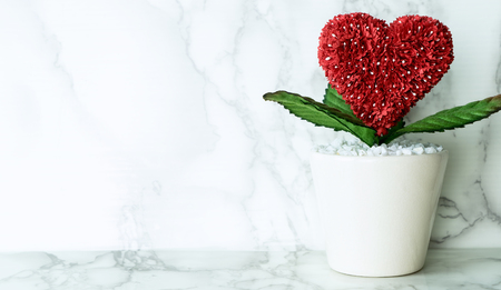 Love heart flower on marble surface with copy spaceの写真素材