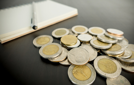 Financial money planning on a blank notebookの写真素材