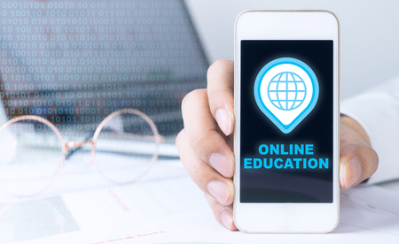 Business man is holding phone for Online Educationの写真素材