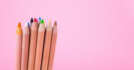Bunch of Multicolor Pencil on pink background copy spaceの写真素材