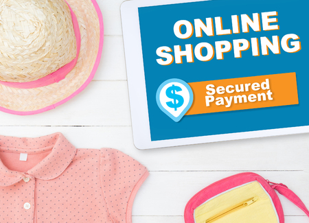 Fashion online shopping on tablet with secure paymentの写真素材