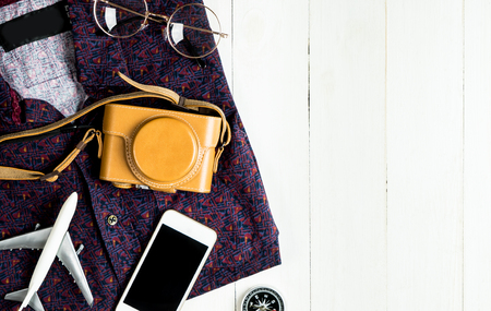 Travel fashion accessories on white wood copy spaceの写真素材