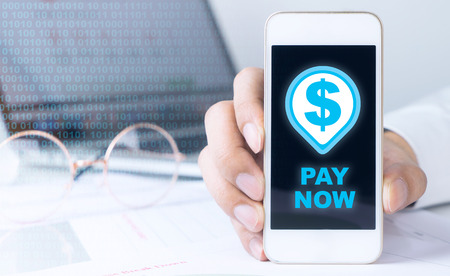 Business man is holding smartphone to pay for online orderの写真素材