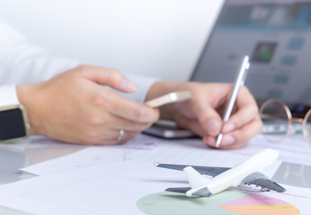 Business manager is working for travel industry officeの写真素材