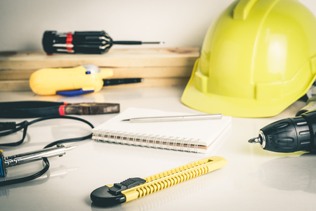 Construction worker repair tools on white desktopの写真素材