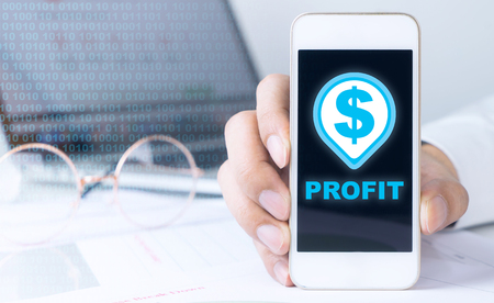 Business man is making profit trading on smartphoneの写真素材