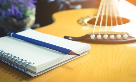 Guitarist Songwriter with blank notebook and pencil for song music writingの写真素材