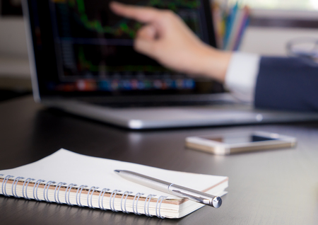 Business man is working on stock market analyzisの写真素材
