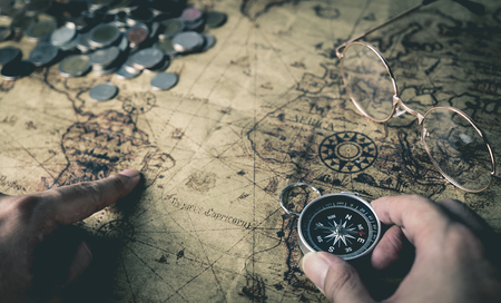 Explorer is Planning and mapping point on vintage mapの写真素材