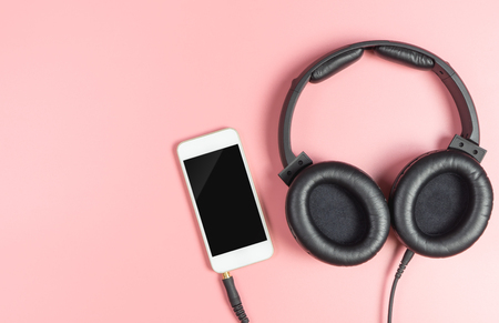 Blank smartphone screen with headphone for music listeningの写真素材