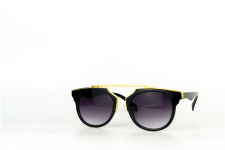 Gold vintage sunglasses stack focus islated on whiteの写真素材
