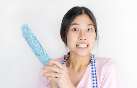 Asian housewife is angry wtih house work overloadの写真素材