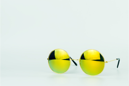 Yellow shade sunglasses isolated on white backgroundの写真素材