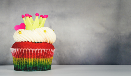 Rainbow love heart king cupcake on gray copy spaceの写真素材