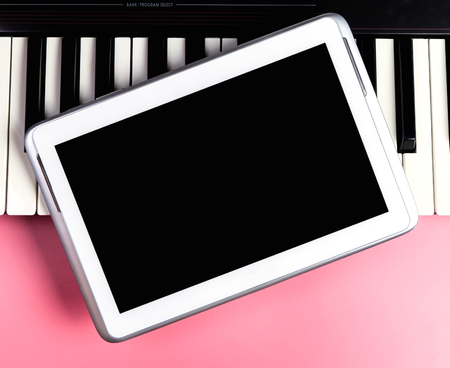 Blank tablet for Music application mock up on keyboardの写真素材