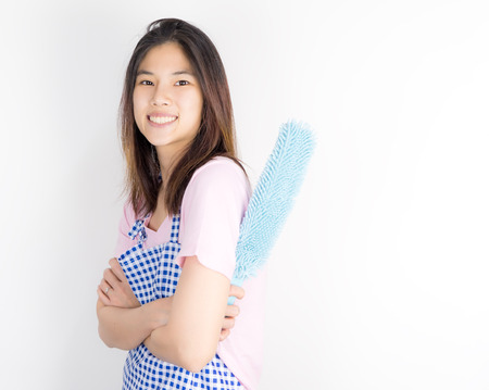 Asian house cleaner maid with dust cleaner isolated on white copy space.の写真素材