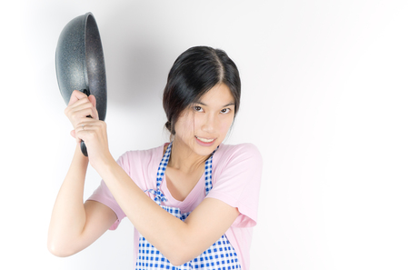 Angry House wife is ready to hit you with a panの写真素材