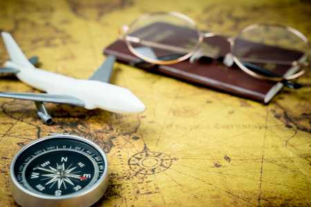 Vintage Explorer travel accessories on vintage mapの写真素材