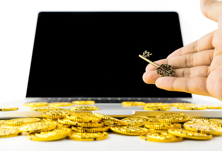 Giving Key for Success and Richness online computer concept with blank computer screenの写真素材